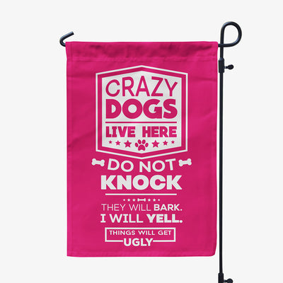 pink garden flag with text "crazy dogs live here, do not knock, they will bark, I will yell, things will get ugly"