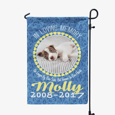 blue garden flag with text "in loving memory, no longer by our side, but forever in our hearts, Molly two thousand eight to two thousand seventeen" with image of dog in circular frame