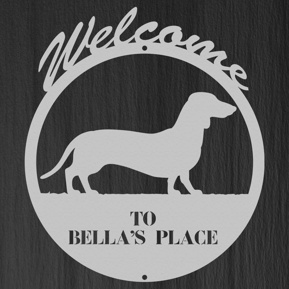 circular dog themed metal sign with text "welcome, to bellas place"