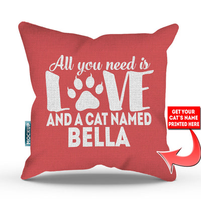 pink colored pillow with text "all you need is love and a cat named bella"