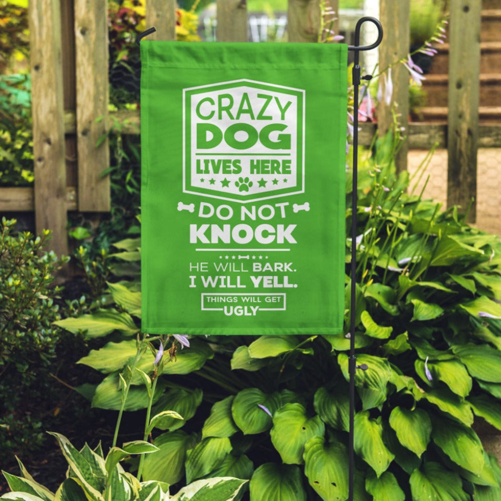 green garden flag with text "crazy dog lives here, do not knock, he will bark, i will yell, things will get ugly"