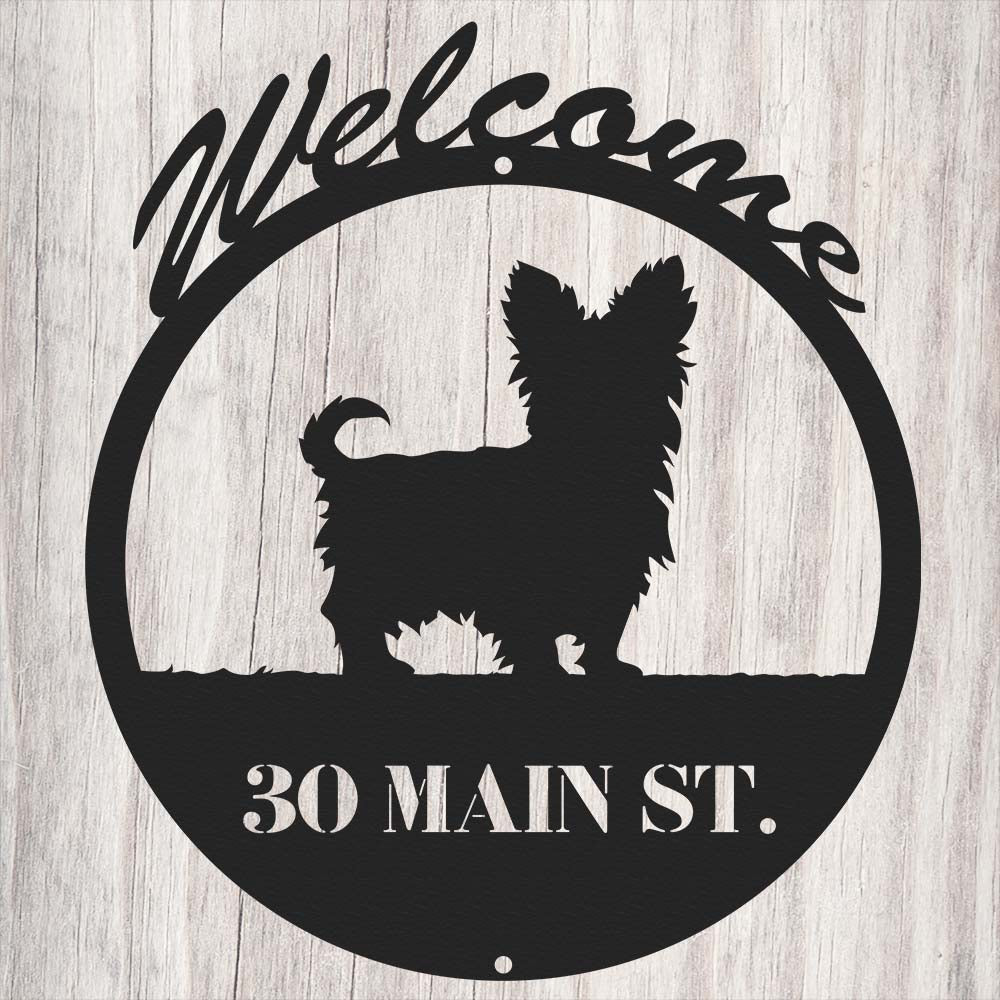 circular dog themed metal sign with text "welcome, thirty main st."