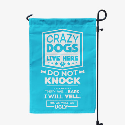 blue garden flag with text "crazy dogs live here, do not knock, they will bark, I will yell, things will get ugly"