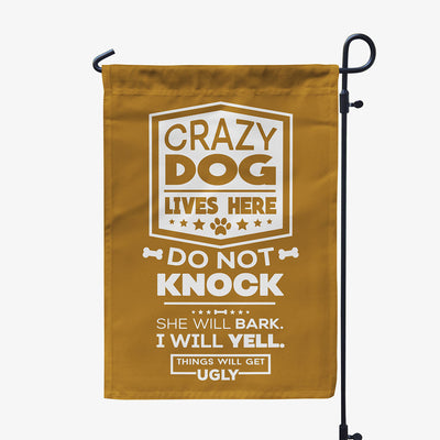 brown garden flag with text "crazy dog lives here, do not knock, she will bark, I will yell, things will get ugly"