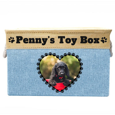 Brown toy box with text "Penny's toy box", image of dog in heart-shaped frame on toy box