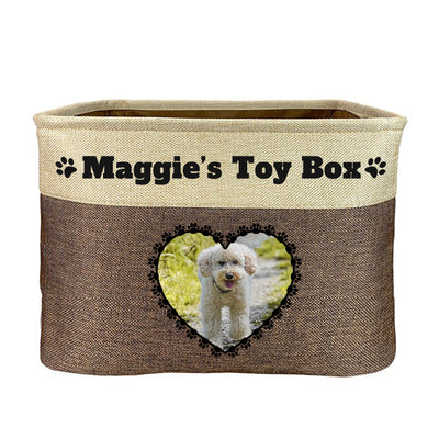 Brown toy box with text "maggie's toy box", image of dog in heart-shaped frame on toy box
