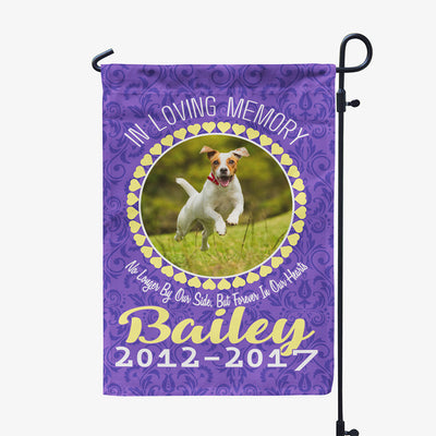 purple garden flag with text "in loving memory, no longer by our side, but forever in our hearts, Bailey two thousand twelve to two thousand seventeen" with image of dog in circular frame