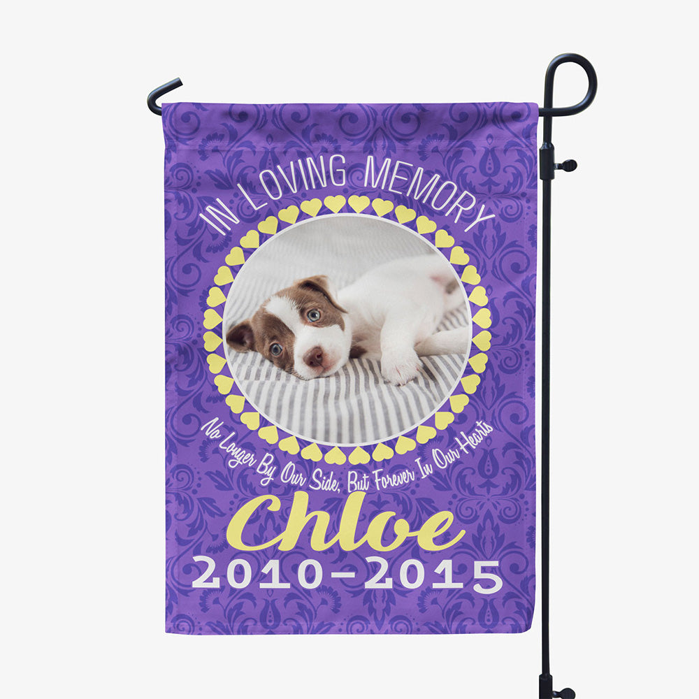 purple garden flag with text "in loving memory, no longer by our side, but forever in our hearts, Chloe two thousand ten to two thousand fifteen" with image of dog in circular frame