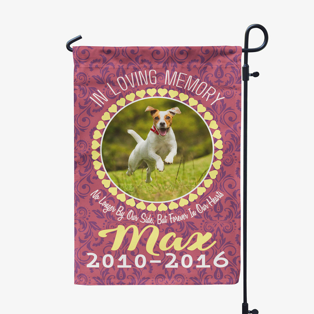 red garden flag with text "in loving memory, no longer by our side, but forever in our hearts, Max two thousand ten to two thousand sixteen" with image of dog in circular frame
