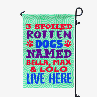 green garden flag with text "three spoiled rotten dogs named bella, max and lolo live here"