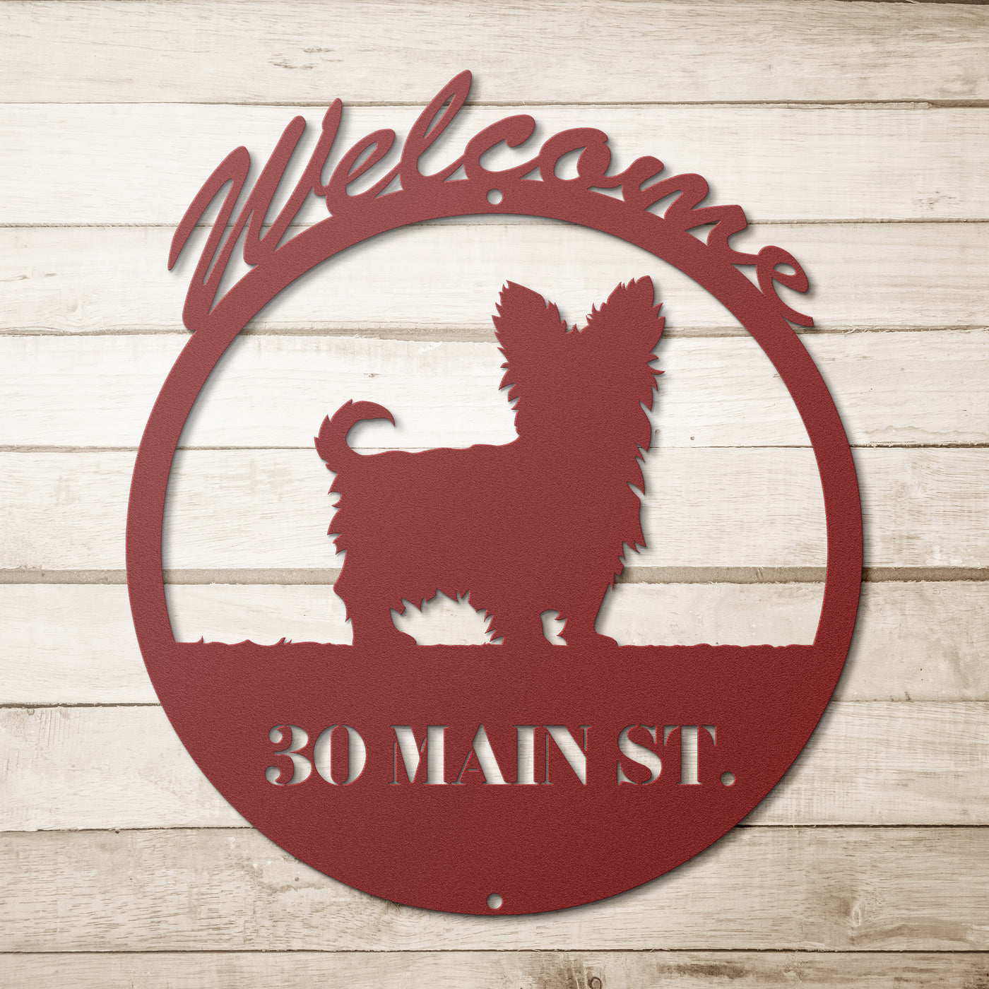 red circular dog themed metal sign with text "welcome, thirty main st."