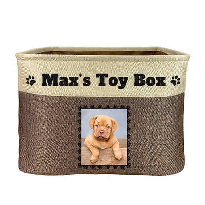 Brown toy box with text "max's toy box", image of dog in rectangular frame on toy box