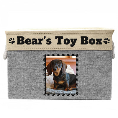 Grey toy box with text "Bear's toy box", image of dog in rectangular frame on toy box