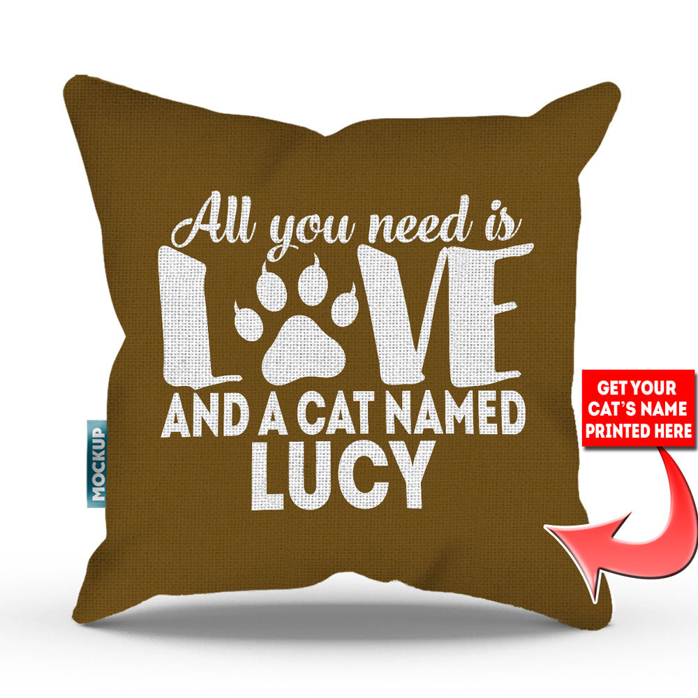 golden brown colored pillow with text "all you need is love and a cat named lucy"
