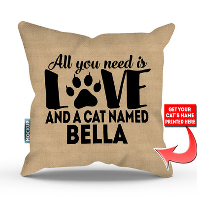 tan colored pillow with text "all you need is love and a cat named bella"