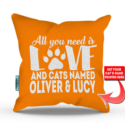 orange colored pillow with text "all you need is love and cats named oliver and lucy"