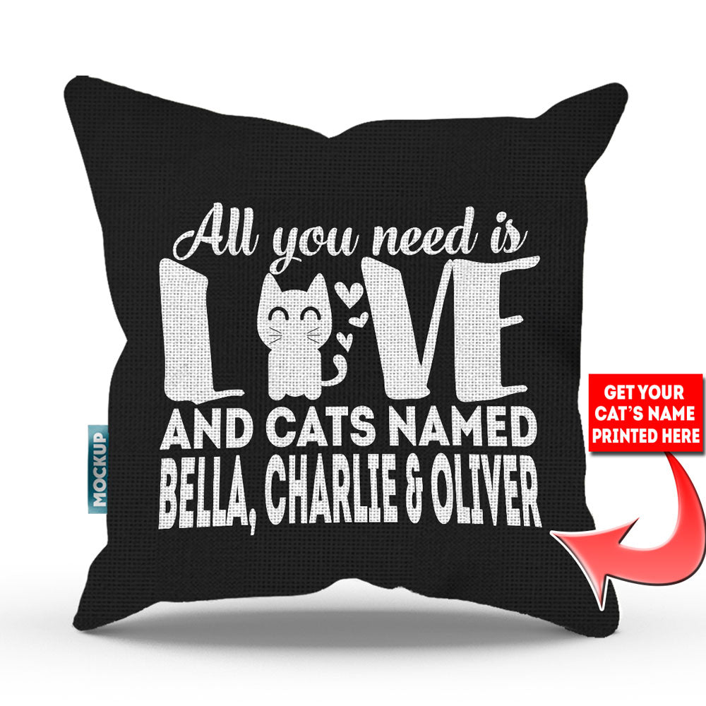 black colored pillow with text "all you need is love and cats named bella, charlie, and oliver"