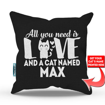 black colored pillow with text "all you need is love and a cat named max"