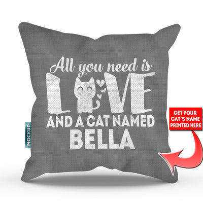 grey colored pillow with text "all you need is love and a cat named bella"