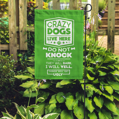green garden flag with text "crazy dogs live here do not knock they will bark, i will yell, things will get ugly"