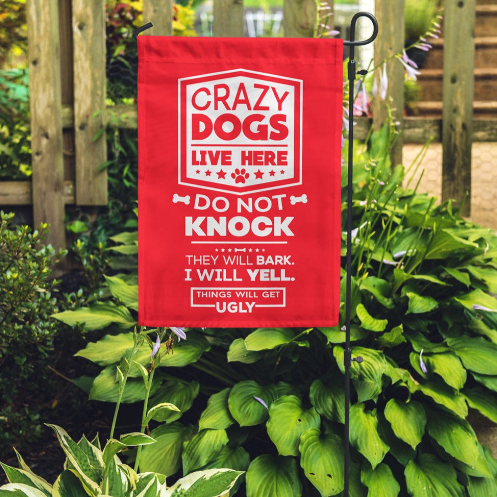 red garden flag with text "crazy dogs live here do not knock they will bark, i will yell, things will get ugly"