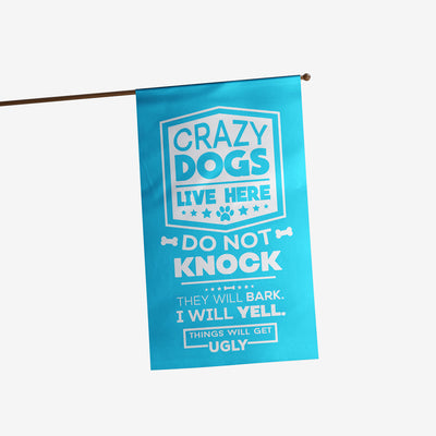light blue house flag with text "crazy dogs live here do not knock they will bark, i will yell, things will get ugly"