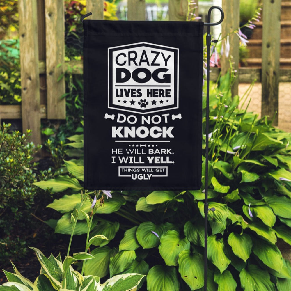 black garden flag with text "crazy dog lives here, do not knock, he will bark, i will yell, things will get ugly"