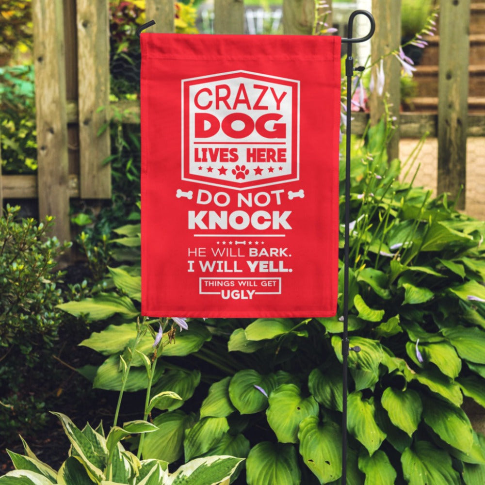 red garden flag with text "crazy dog lives here, do not knock, he will bark, i will yell, things will get ugly"