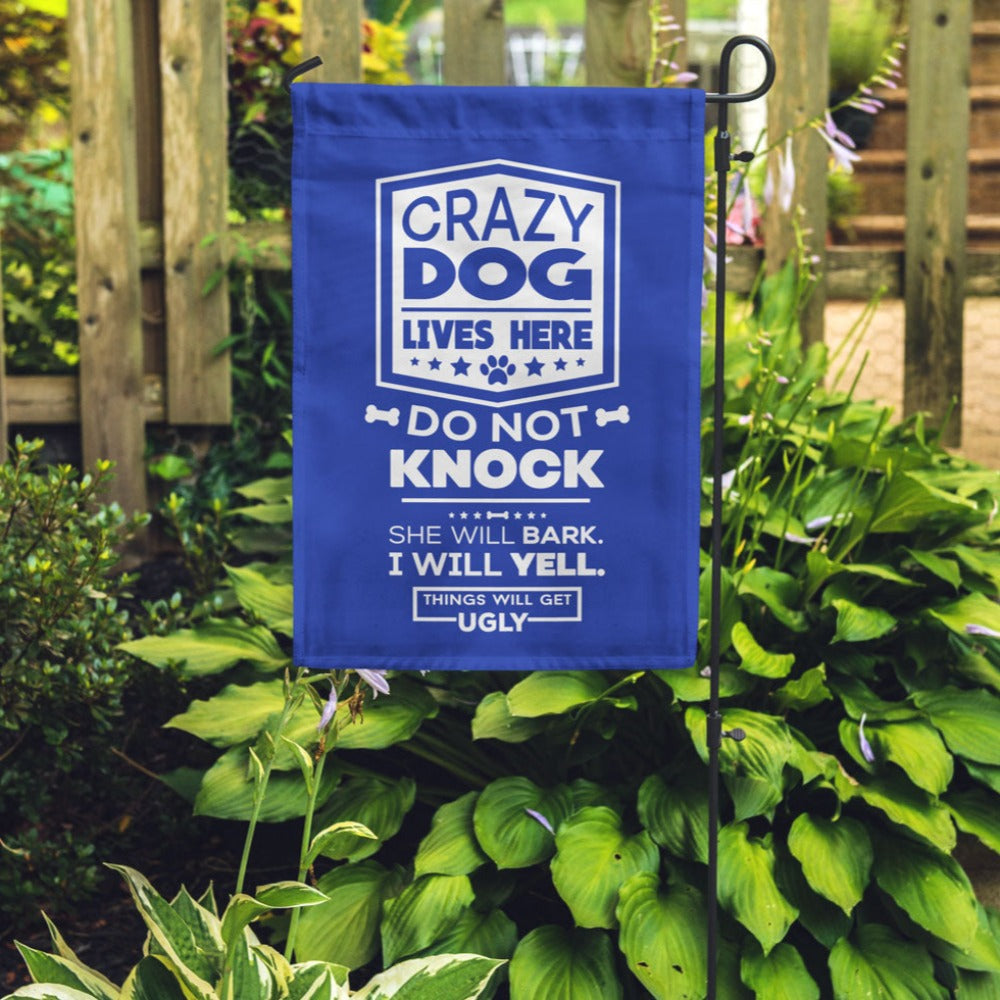 dark blue garden flag with text "crazy dog lives here, do not knock, she will bark, i will yell, things will get ugly"