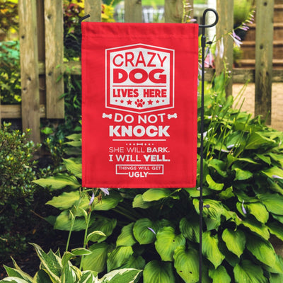red garden flag with text "crazy dog lives here, do not knock, she will bark, i will yell, things will get ugly"