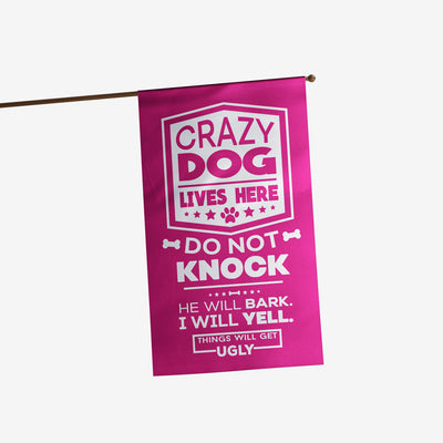 pink house flag with text "crazy dog lives here, do not knock, he will bark, i will yell, things will get ugly"