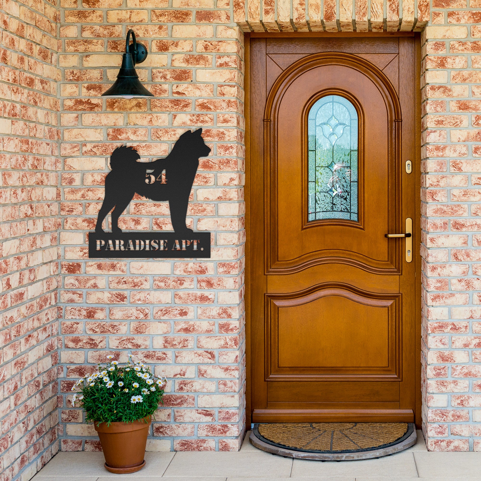 mockup of dog themed metal sign hung up on porch wall with text "fifty four paradise apt"