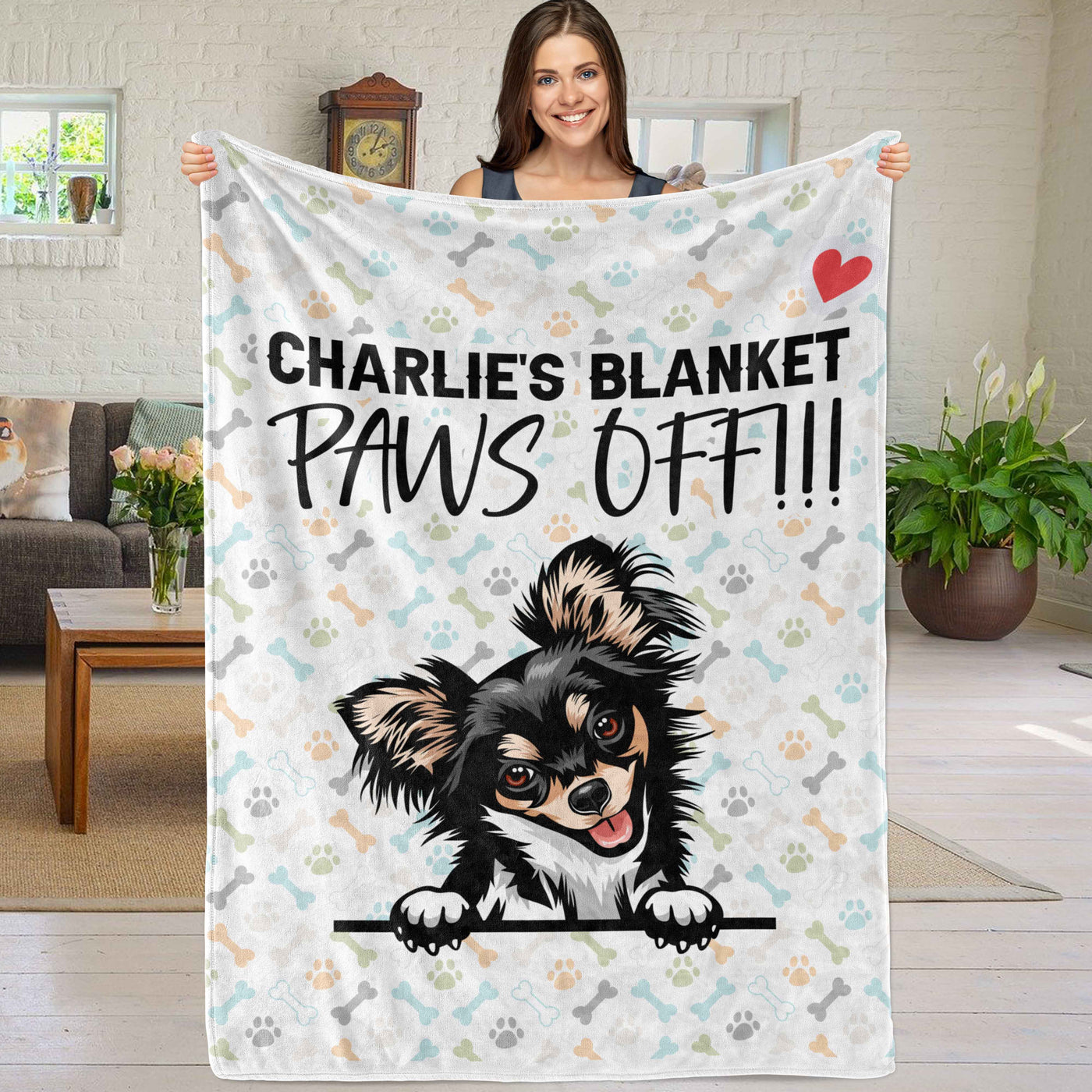 person holding up mostlypaws blanket
