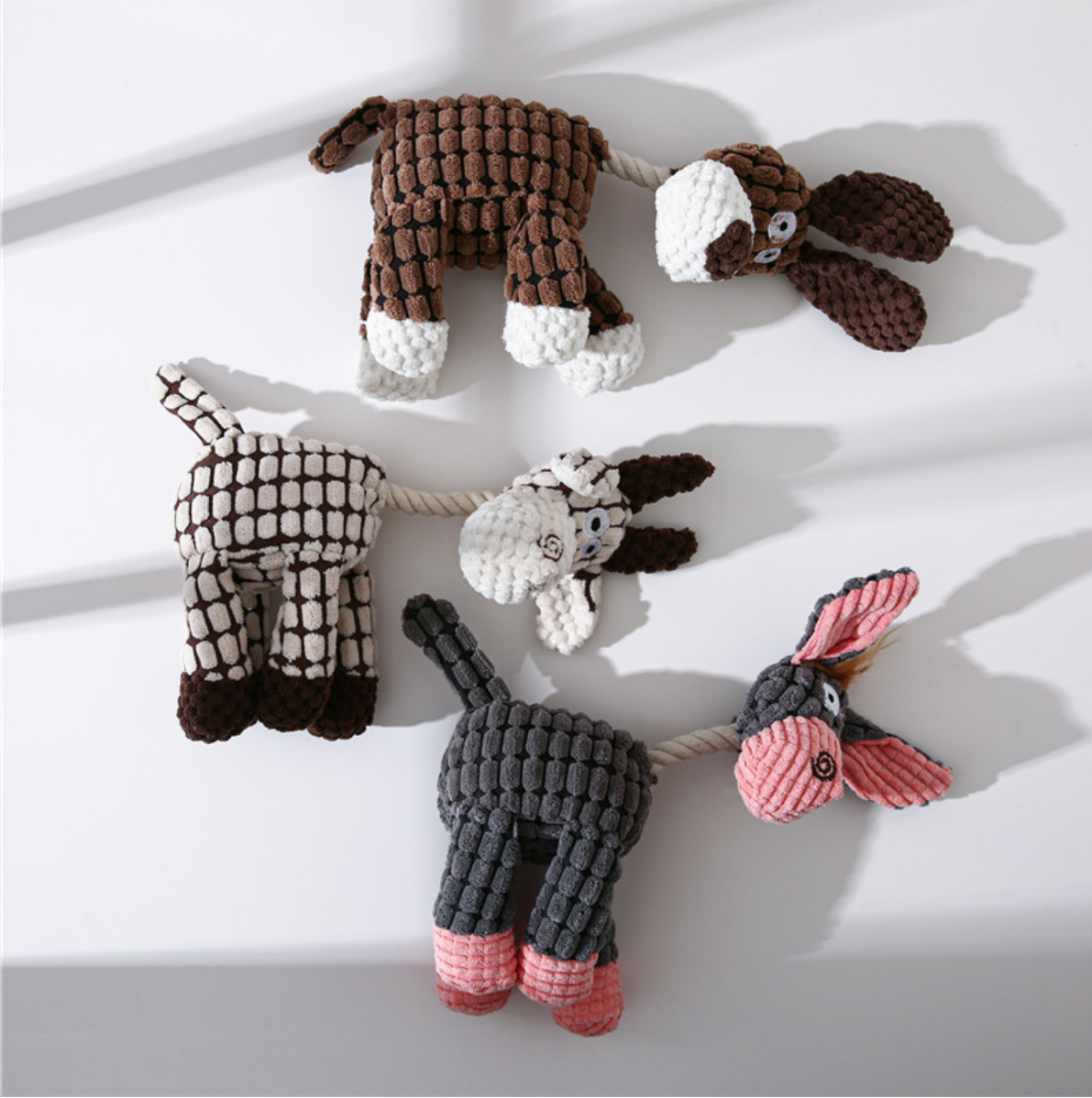 three donkey-shaped dog toys