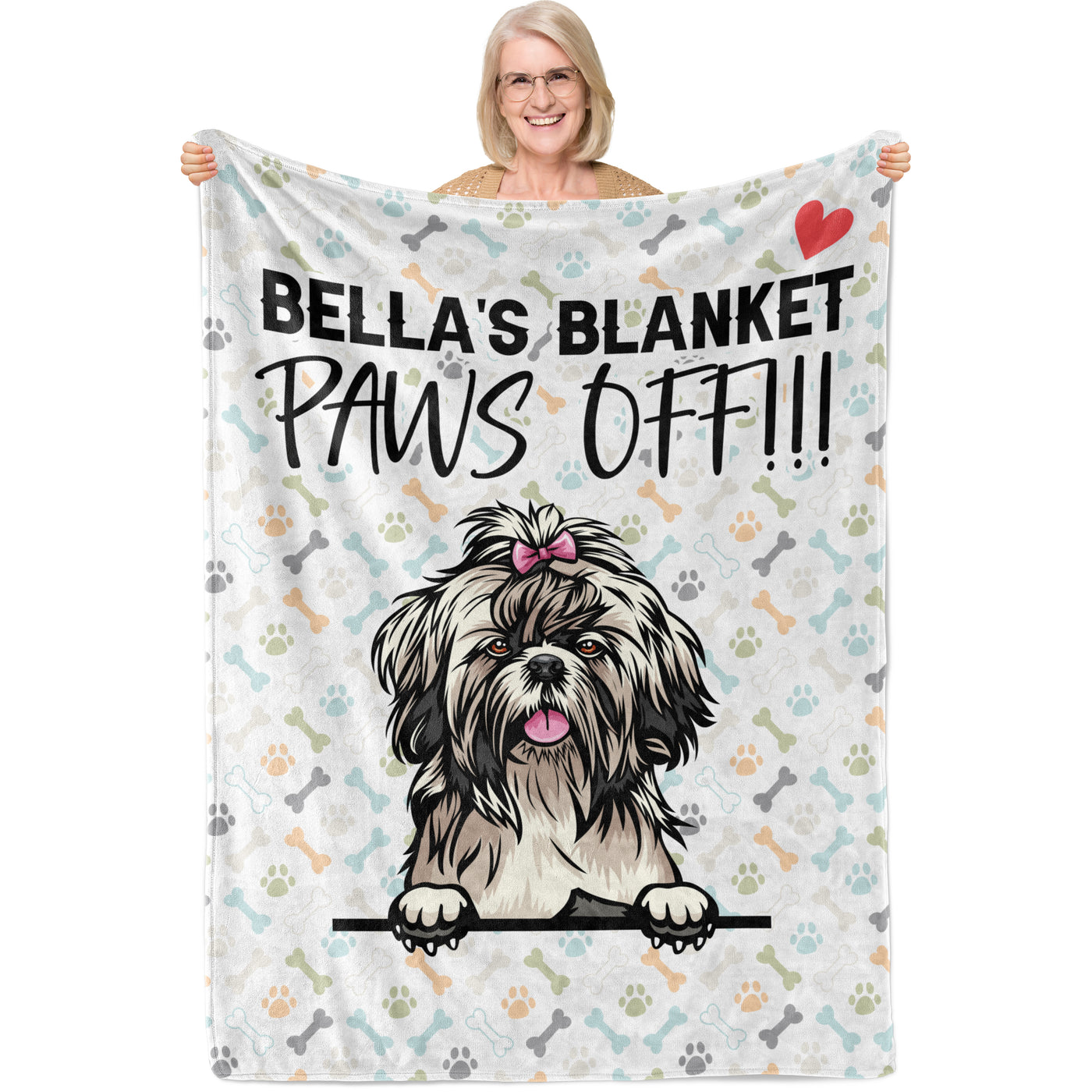 person holding up mostlypaws blanket